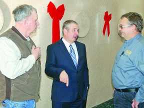 Conservative Party candidate for the Macleod Riding Phil Rowland, centre, chats with Bob West, right, and Jack Roebuck Saturday, Dec. 14, at the Vulcan Legion Hall, where a meet and greet event with Rowland was held. Simon Ducatel Vulcan Advocate
