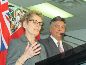Ontario Premier Kathleen Wynne with Finance Minister Charles Sousa. (Toronto Sun files)