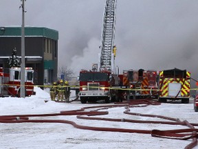 Kingston firefighters battle a huge blaze in the city's downtown Tuesday afternoon.
Elliot Ferguson The Whig-Standard