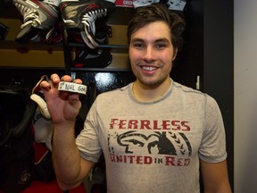 Orleans native Cody Ceci holds up the puck from his first career NHL goal, the OT winner against the St. Louis Blues Monday night.