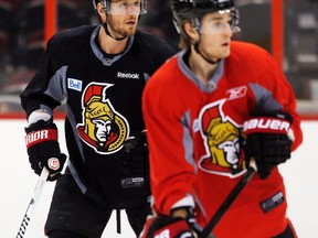 Ottawa Senators Marc Methot, left, and Kyle Turris, scrimmage during team practice at the Canadian Tire Centre on Monday.