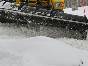 A plow clears a road