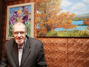 Artist Greg Maskwa at his art show at the Laughing Buddha on Monday night. The show, sponsored by the Art Gallery of Sudbury, featured a variety of Maskwa's artwork.  GINO DONATO/The Sudbury Star