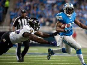 Detroit Lions running back Reggie Bush breaks a tackle by Baltimore Ravens linebacker Terrell Suggs (55) to score a touchdown during the first quarter Monday at Ford Field. (Tim Fuller/USA TODAY Sports)