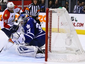 Panthers’ Brad Boyes gets the puck past Maple Leafs goalie James Reimer in the second period at the Air Canada Centre last night.