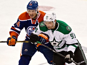Stars defenceman Sergei Gonchar (right), seen here defending against Oilers' Corey Potter, doesn't feel worthy of being selected to play at the 2014 Winter Games in his native Russia. (Codie McLachlan/QMI Agency/Files)