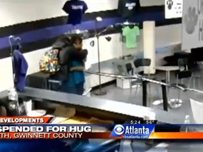 Atlanta high school student Sam McNair is pictured hugging his teacher in this screenshot from CBS Atlanta video.