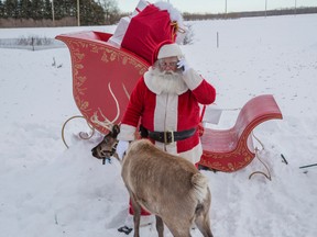Santa needed help after transportation problems on the way to Calgary for a pre-Christmas visit. (SUPPLIED)