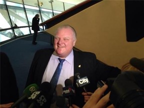 Mayor Rob Ford speaks to media at City Hall on Wednesday. (DON PEAT/Toronto Sun)