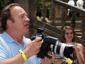 Actor Jim Belushi takes pictures of photographers during the Seventh Annual Kidstock Music and Art Festival to benefit One Voice Scholars, at the Greystone Mansion on June 2, 2013 in Beverly Hills, California.   Frederick M. Brown/Getty Images/AFP