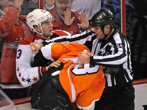 Washington Capitals forward Tom Wilson (left) fights Philadelphia Flyers defenceman Nicklas Grossmann during the second period Tuesday at Wells Fargo Center. (Eric Hartline/USA TODAY Sports)