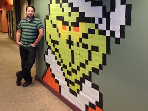 Ducks Unlimited's IT workers set out to show their office they can be creative -- by building a giant post-it note Grinch. Developer Colin Koop hopes they'll win the decorating contest this year. (HANDOUT)