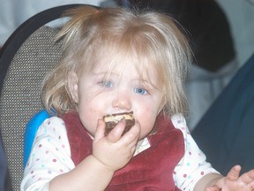 Tarra Fox, 15 months, enjoys a chocolate dessert at the 39thannual Childs family luncheon held on Dec. 16 at the UAW Hall. The luncheon is a fundraiser for the Wallaceburg Salvation Army Christmas campaign.