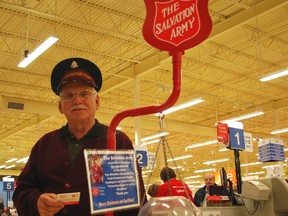 Salvation Army volunteer Bob Barrett stands with a Christmas kettle at the Real Canadian Superstore in St. Thomas on Wednesday. The campaign is about $40,000 short of its $120,000 fundraising goal for St. Thomas and Elgin, with less than a week before the close of the campaign.