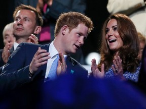 Britain's Prince Harry, left, and Duchess of Cambridge Kate Middleton applaud as they view the closing ceremony of the London 2012 Olympic Games at the Olympic Stadium on August 12, 2012. (REUTERS/Stefan Wermuth)