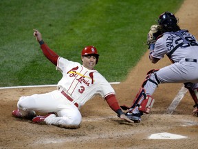 St. Louis Cardinals outfielder Carlos Beltran (3) slides past Boston Red Sox catcher Jarrod Saltalamacchia (39) during Game 3 of the World Series at Busch Stadium. (Darr Beiser/USA TODAY Sports)