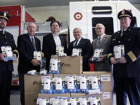 The Insurance Bureau of Canada’s Doug DeRabbie dropped by the Tillsonburg Fire Hall Tuesday morning, dropping off 96 donated CO detectors (48 apiece for South West Oxford (SWOX) and Tillsonburg’s fire services) as part of his visit. The occasion was inspired in part by Oxford MPP Ernie Hardeman’s private members bill, passed November 12 as the Hawkins-Gignac Act requiring CO detectors in habitated units. From left, are: Jeff Van Rybroeck, Fire Chief SWOX, SWOX Mayor David Mayberry, DeRabbie, Hardeman, Tillsonburg Mayor John Lessif, and Tillsonburg Fire Chief Jeff Smith. Jeff Tribe/Tillsonburg News