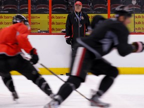 Ottawa Senators head coach Paul MacLean watches his players skate lines at the end of practice at Canadian Tire Centre in Ottawa on Tuesday October 1,2013. Errol McGihon/Ottawa Sun/QMI Agency