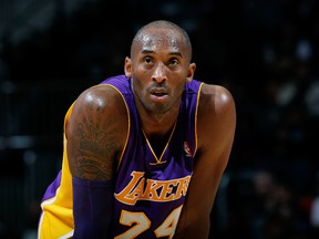 Kobe Bryant #24 of the Los Angeles Lakers stands during a free throw against the Atlanta Hawks at Philips Arena on December 16, 2013 in Atlanta, Georgia. (Kevin C. Cox/Getty Images/AFP)