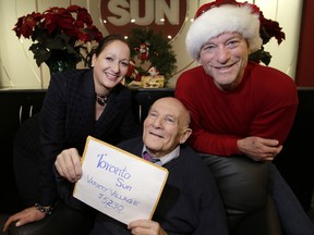 Mort Greenberg delivers his envelope for Variety Village to the Sun's Christina Fleming and Mike Strobel on Thursday. (CRAIG ROBERTSON/Toronto Sun)