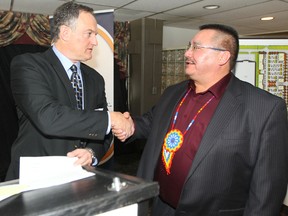 Peguis First Nation Chief Glenn Hudson (right) appeared at Assiniboia Downs today to discuss a proposed joint venture with the Manitoba Jockey Club.  Darren Dunn (left) is the Chief Executive Officer of the Manitoba Jockey Club, Thursday, Dec. 19, 2013.