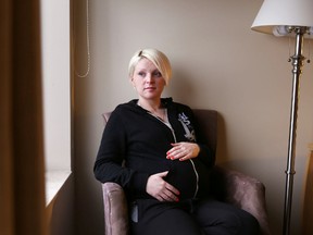 Seven and a half months pregnant, Amanda Roberts, 27, lost everything in Tuesday's fire in midtown Kingston. “My baby is coming in February and I don't have anything," she says. "What now?"
Elliot Ferguson The Whig-Standard