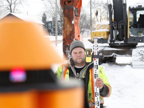 Brandon Ramsey, of Dekeyser Excavation, uses a laser level to set his marker while  breaking bedrock along the footprint of the Station Street site of the new Belleville fire headquarters, on Tuesday. 
Jason Miller/The Intelligencer