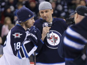 Forward Blake Wheeler (centre) interviews centre Bryan Little for the team website during the 2013 Winnipeg Jets skills competition at MTS Centre in Winnipeg, Man., on Wed., Dec. 18, 2013. Kevin King/Winnipeg Sun/QMI Agency