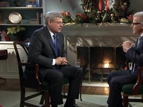 Prime Minister Stephen Harper speaks with Pierre Bruneau during a year-end interview with TVA in Ottawa, Thursday, Dec. 19, 2013.  (QMI Agency)