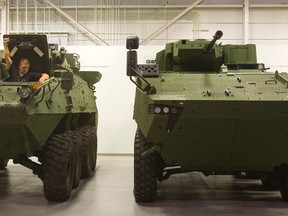 General Dynamics Land Systems new Close Combat Vehicle, right, and the LAV3 also made by GDLS in London. (Free Press file photo)