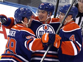 Sam Gagner and Nail Yakupov, shown here celebrating a goal late last season with teammate Taylor Hall, are at the bottom of the league in plus-minus. (David Bloom, Edmonton Sun)