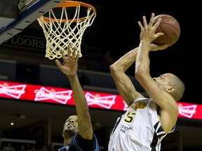 Garrett Williamson of the London Lightning looks to score while under pressure from David Lawrence of the Halifax Rainmen during National Basketball League of Canada action at Budweiser Gardens on Thursday. The Lightning won 108-90. (CRAIG GLOVER, The London Free Press)
