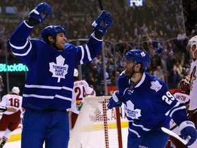 Troy Bodie and Jerry D'Amigo of the Toronto Maple Leafs celebrate Bodie's goal against the Phoenix Coyotes during NHL action at the Air Canada Centre on December 19, 2013. (Dave Abel/Toronto Sun/QMI Agency)