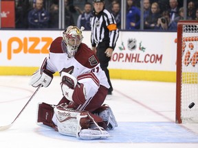 Coyotes goalie Mike Smith is beaten on a shot in the shootout by Maple Leafs' Joffrey Lupul on Thursday night at the Air Canada Centre. (Tom Szczerbowski/USA TODAY)
