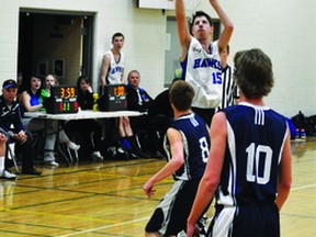 Nolan Selke made this shot just before the buzzer during the Hawks' game Dec. 18 against Fort Macleod's F.P. Walshe High School. Stephen Tipper Vulcan Advocate