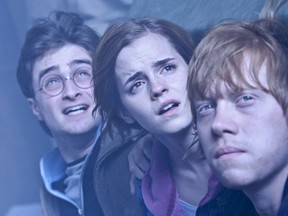 Daniel Radcliffe, left, Emma Watson, centre, and Rupert Grint star in the "Harry Potter" film series. (Handout)