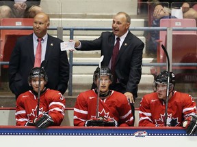 Head coach Brent Sutter of Team Canada handles bench duties in the game against Team Sweden during the 2013 USA Hockey Junior Evaluation Camp at the Lake Placid Olympic Center on August 8, 2013 in Lake Placid, New York.(Bruce Bennett/Getty Images/AFP)