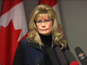Heritage Minister Shelley Glover discusses a Supreme Court ruling on prostitution at her Winnipeg constituency office Dec. 20, 2013. (RICH POPE/Winnipeg Sun)