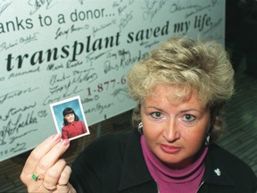 Cheryl Parker holds up a picture of organ donor daughter Rachel Davidson,8, who donated her heart, 2 lungs and 2 corneas.  She died from complications of ITP, a viral infection one month after seeing the transplant front page of the Toronto Sun.