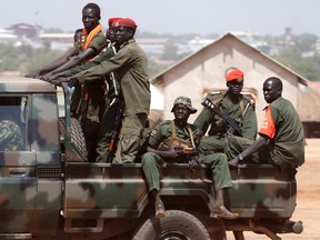 SPLA soldiers drive in a vehicle in Juba December 21, 2013. (REUTERS/Goran Tomasevic )