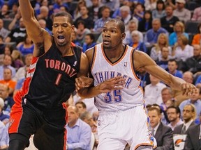 Toronto Raptors' Dominic McGuire (left) battles Oklahoma City Thunder forward Kevin Durant last season. (Bill Waugh/Reuters)
