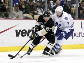 Pittsburgh Penguins center Sidney Crosby handles the puck under pressure from Toronto Maple Leafs defenseman Dion Phaneuf during the second period at the CONSOL Energy Center. (Charles LeClaire/USA TODAY Sports)