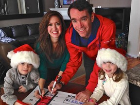 United Way campaign chair Brian Black, with his wife Tasha and children Max and Abby, colour in the thermometer representing the agency's annual fundraising goal. United Way of Sarnia-Lambton announced it has surpassed its $1.87 million fundraising goal. SUBMITTED PHOTO
