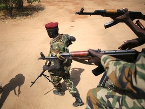 An SPLA soldier walks away from a vehicle in Juba December 21, 2013. (REUTERS/Goran Tomasevic)
