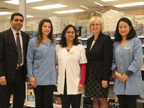 The pharmacy team at the Real Canadian Superstore on Oxford St. W. pose with London-West MPP Peggy Sattler