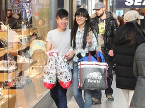 Crowds started early at the Eaton Centre in downtown Toronto to take advantage of Black Friday sales on Friday November 29, 2013. Stan Behal/Toronto Sun/QMI Agency