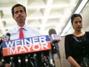 New York mayoral candidate Anthony Weiner and his wife Huma Abedin attend a news conference in New York, in this July 23, 2013, file photo. (REUTERS/Eric Thayer/Files)