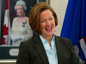 Premier Alison Redford speaks during the swearing in of her new cabinet at Government House in Edmonton, Alta., on Friday, Dec. 13, 2013. Ian Kucerak/Edmonton Sun