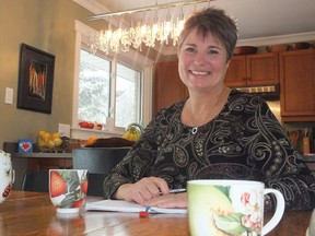 Barb Kunz sits in her West London home. The recent retiree has turned her free 
time into a life dedicated to helping others.