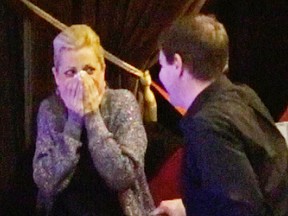 Elf cast member Donnie Macphee proposes to Rosie Shaw in one of the posh balcony boxes at the Grand Theatre prior to Monday?s matinee performance. (MIKE HENSEN, The London Free Press)